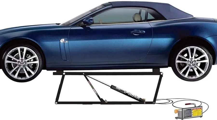 An image of BendPak QuickJack BL-5000SLX Portable Lift - 110, one of the most effective portable car lifts for home garage in use to lift a car in a garage 