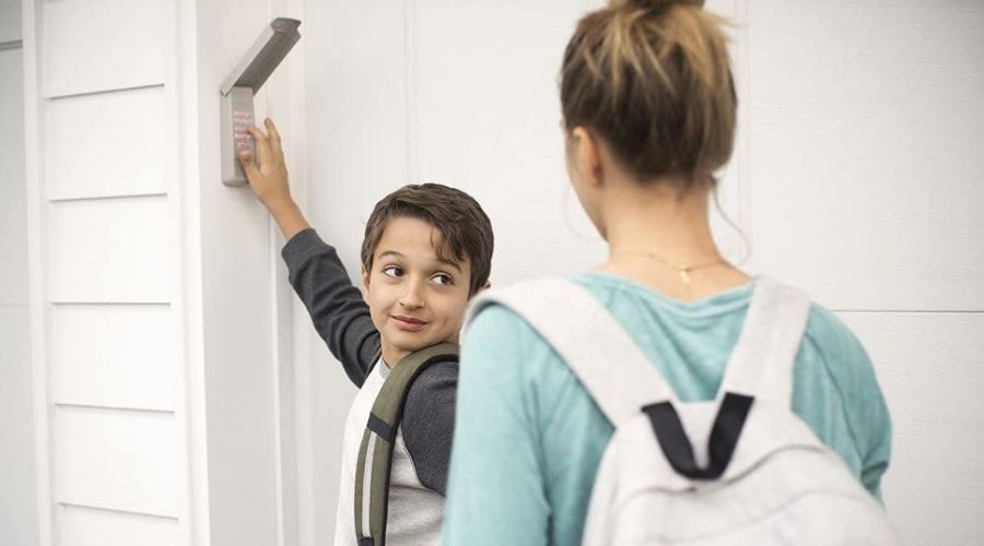 An image of family using Chamberlain Group G940EV-P2 Chamberlain/LiftMaster, one of the most efficient models among the best z-wave garage door opener to open a garage door 