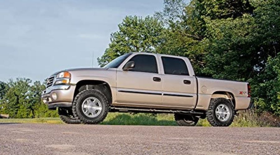 an image showing Rough Country 2.5" Leveling Kit for 99-06 Chevy Silverado GMC Sierra 1500-28330, one of the Best Shocks For Silverado 1500 in use in a vehicle 