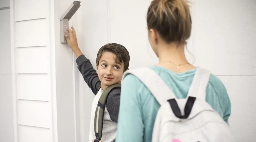 An image of a family opening a garage door using keypad code 