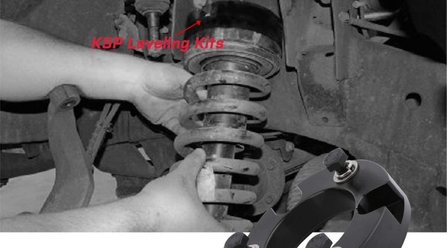 A picture of a mechanic using Leveling Lift kits fit for Tacoma, KSP 3'' Front strut spacer fit for Tacoma 2WD, one of the best models among the best 3-inch lift for tacoma in a car's engine 